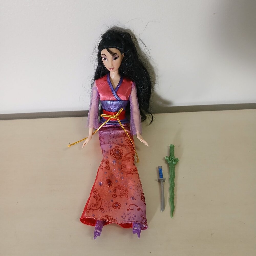 Disney Mulan doll with sword and dagger